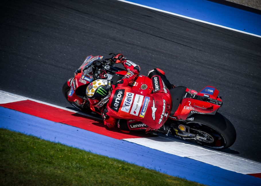 High-speed action shot of a MotoGP race at Misano World Circuit, Italy.