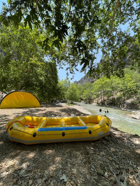 Yellow Rft Yellow Raft and Tent by Scenic Riverbank ยท Free Stock Photo