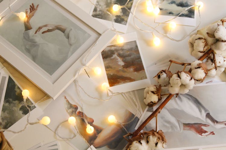 Photo Of String Lights On Top Of Pictures