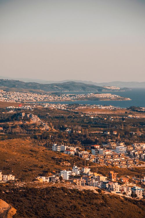Free Stunning aerial view of a coastal urban scene with Mediterranean charm, showcasing architecture and natural beauty. Stock Photo