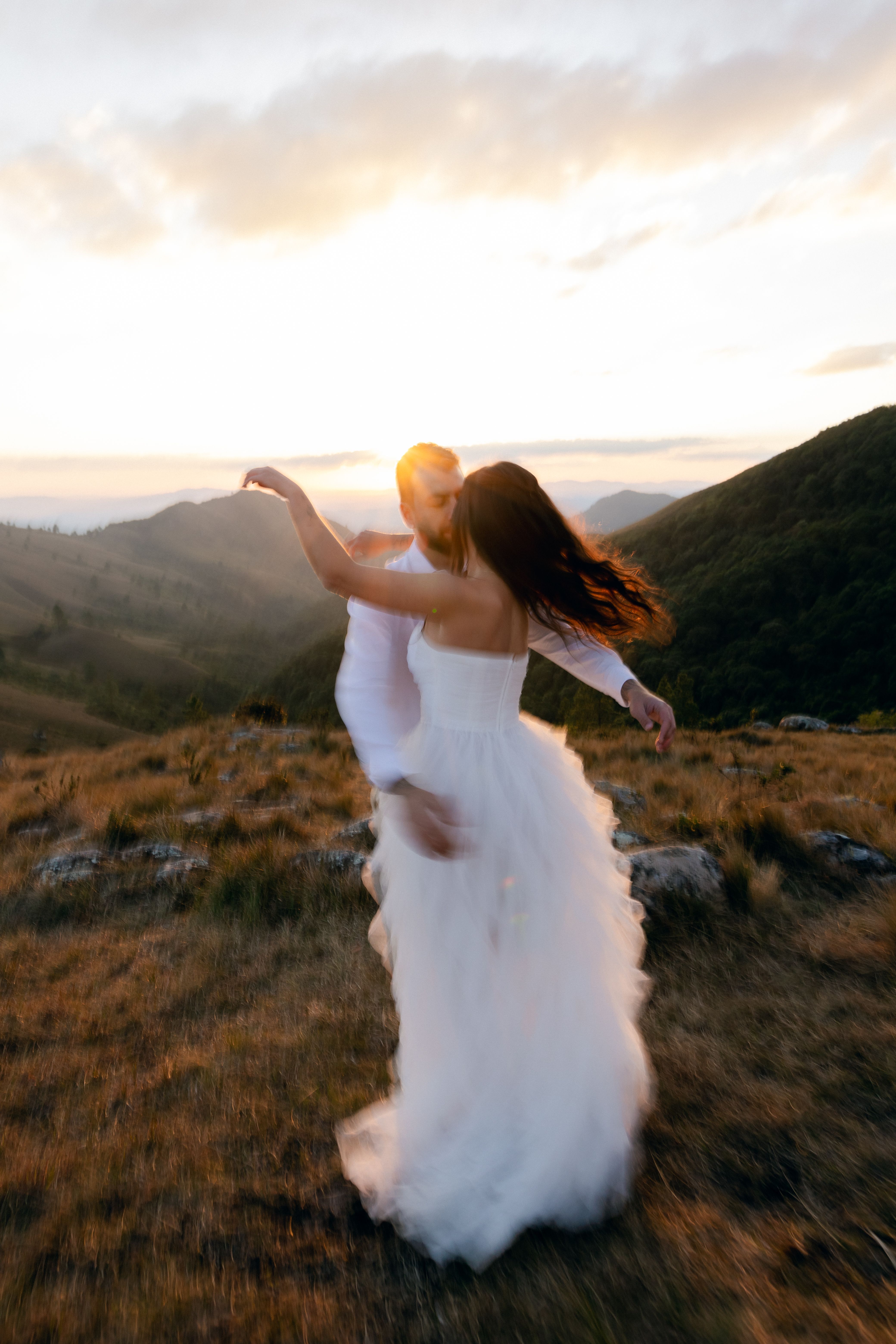 Romantic Wedding Couple Dancing at Sunset · Free Stock Photo