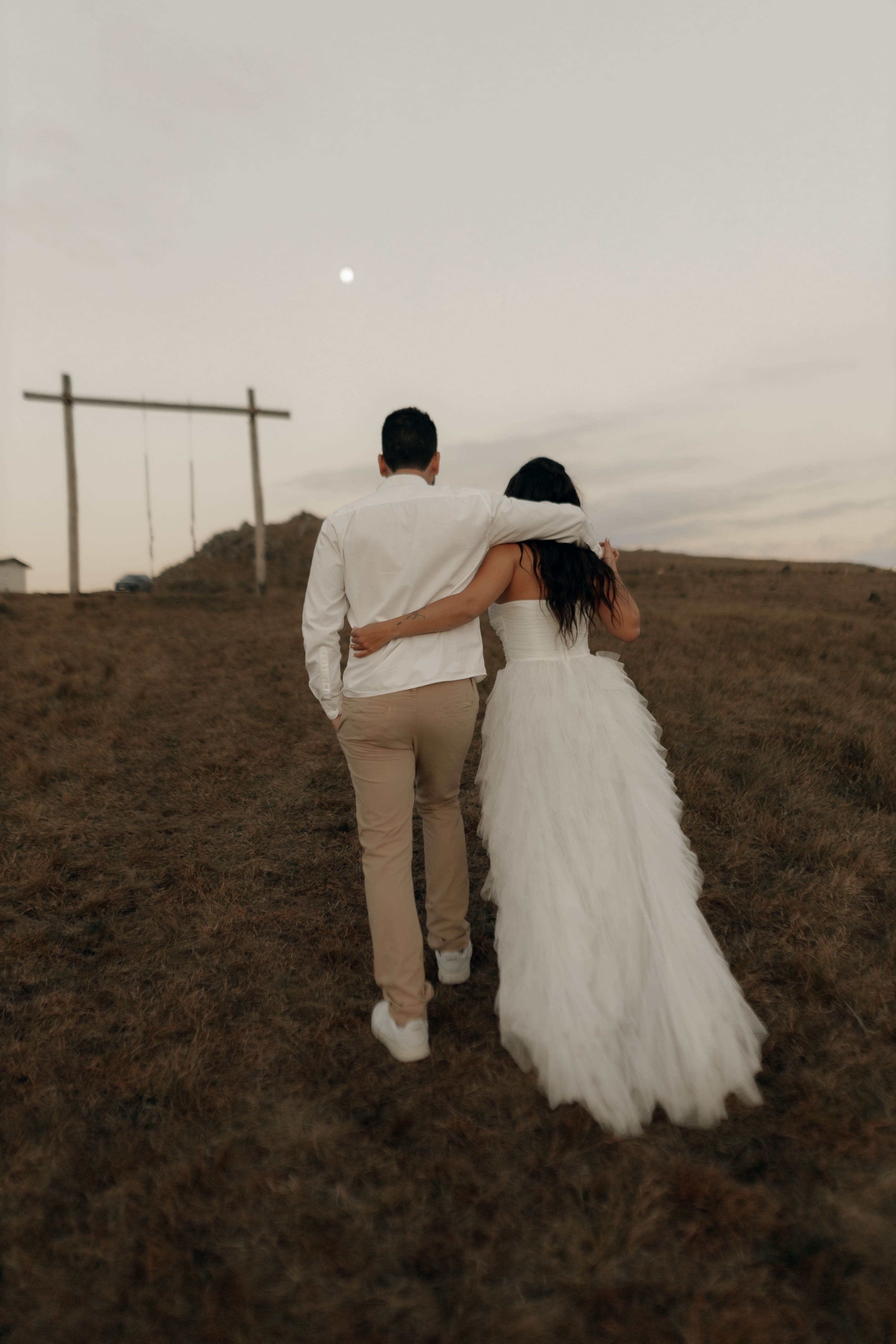 Back View of Bride and Groom Holding Hands · Free Stock Photo