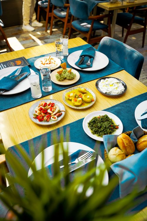 Free A vibrant Mediterranean spread with various dishes on a restaurant table. Stock Photo