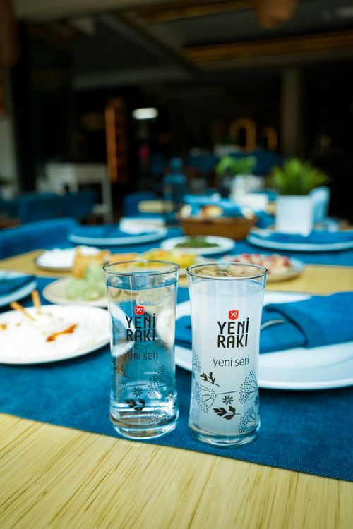 Free Close-up of labeled Yeni Raki glasses on a stylishly set dining table. Stock Photo