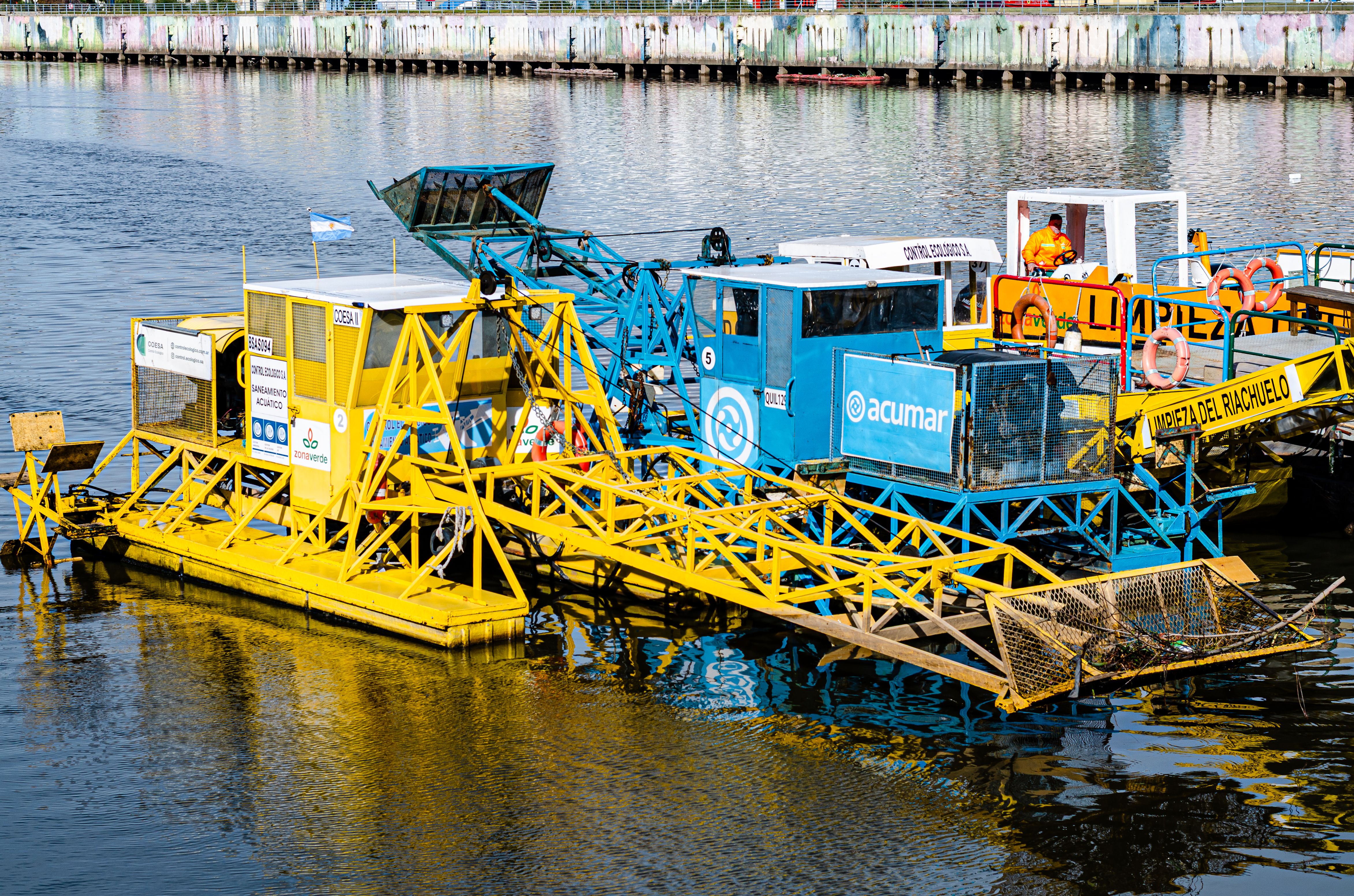 Colorful Industrial River Cleanup Machine · Free Stock Photo