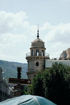 Stunning view of a historic tower in Tbilisi, Georgia showcasing beautiful architecture.