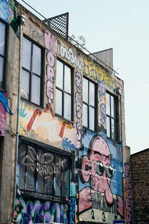 Free Vibrant street art covers a building facade in Tbilisi, showcasing unique urban creative expressions. Stock Photo