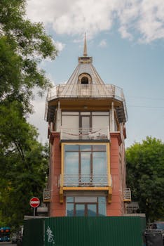 A distinctive triangular building in Tbilisi, Georgia, showcasing unique architecture.
