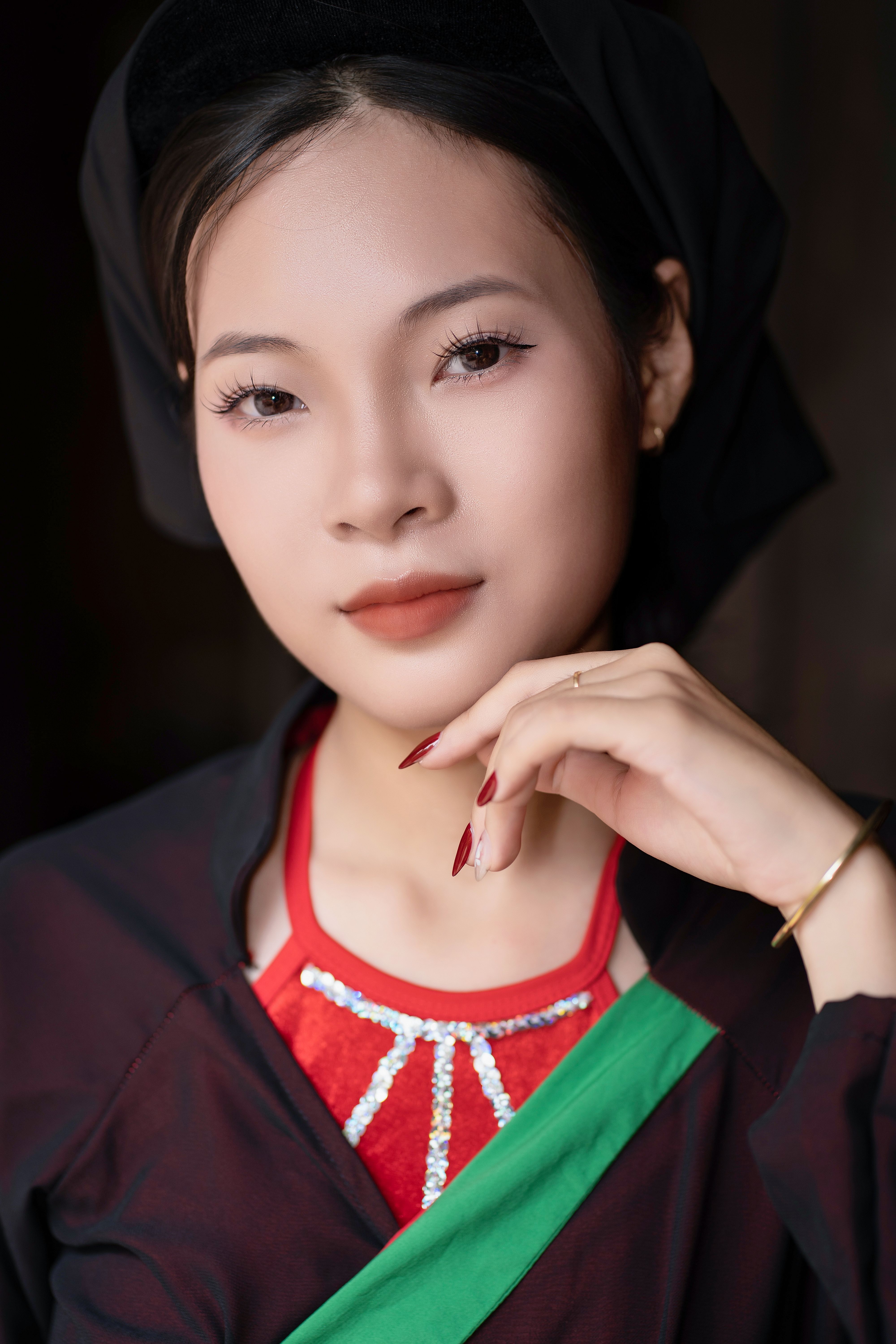Beautiful woman in traditional costume with thoughtful expression.