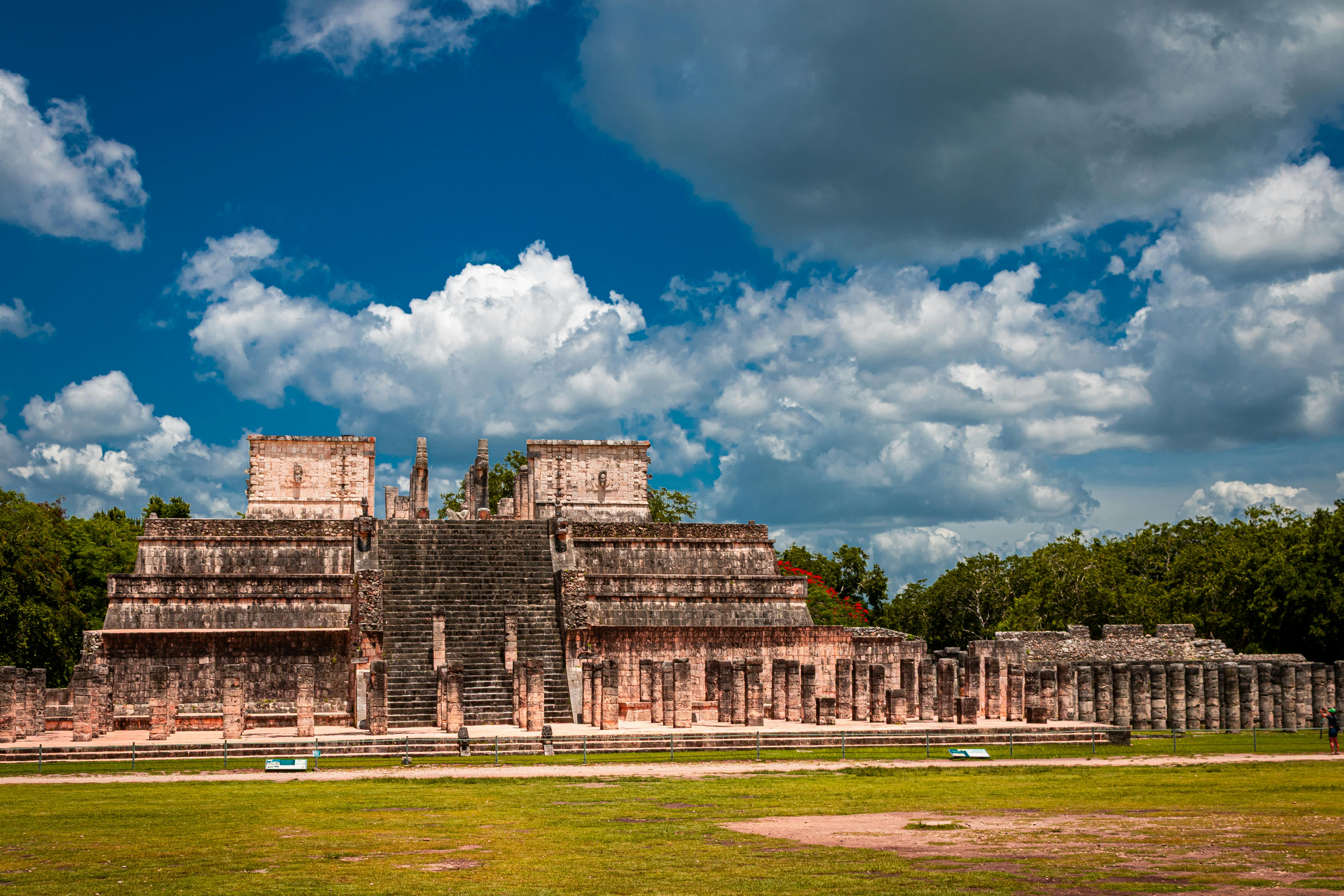 cancun chichen itza private tour - Explore the iconic Mayan ruins of Chichén Itzá in Yucatán, Mexico under a vibrant blue sky.