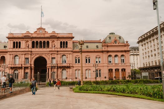 Front view of the historic Casa Rosada in Buenos Aires, Argentina with people in foreground.