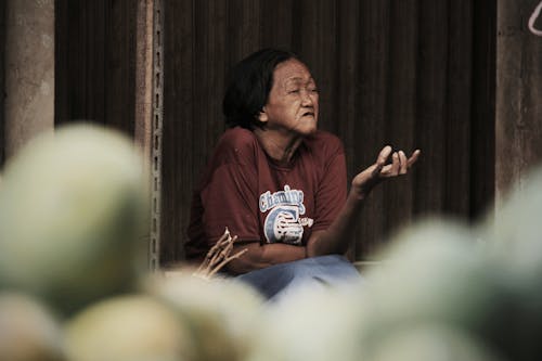 Photo Of An Old Woman Wearing Brown Shirt 