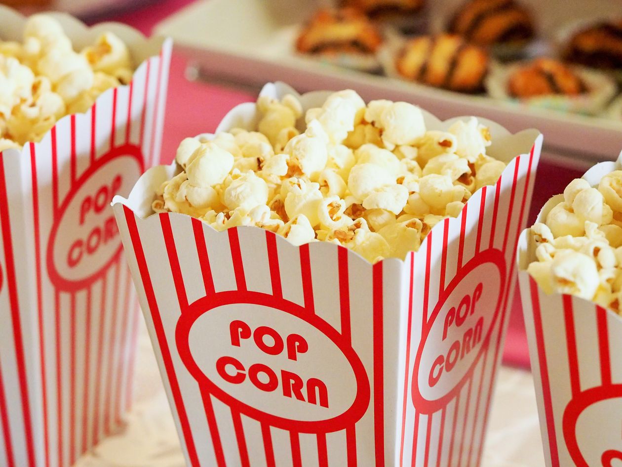 Popcorn in red and white striped cinema boxes