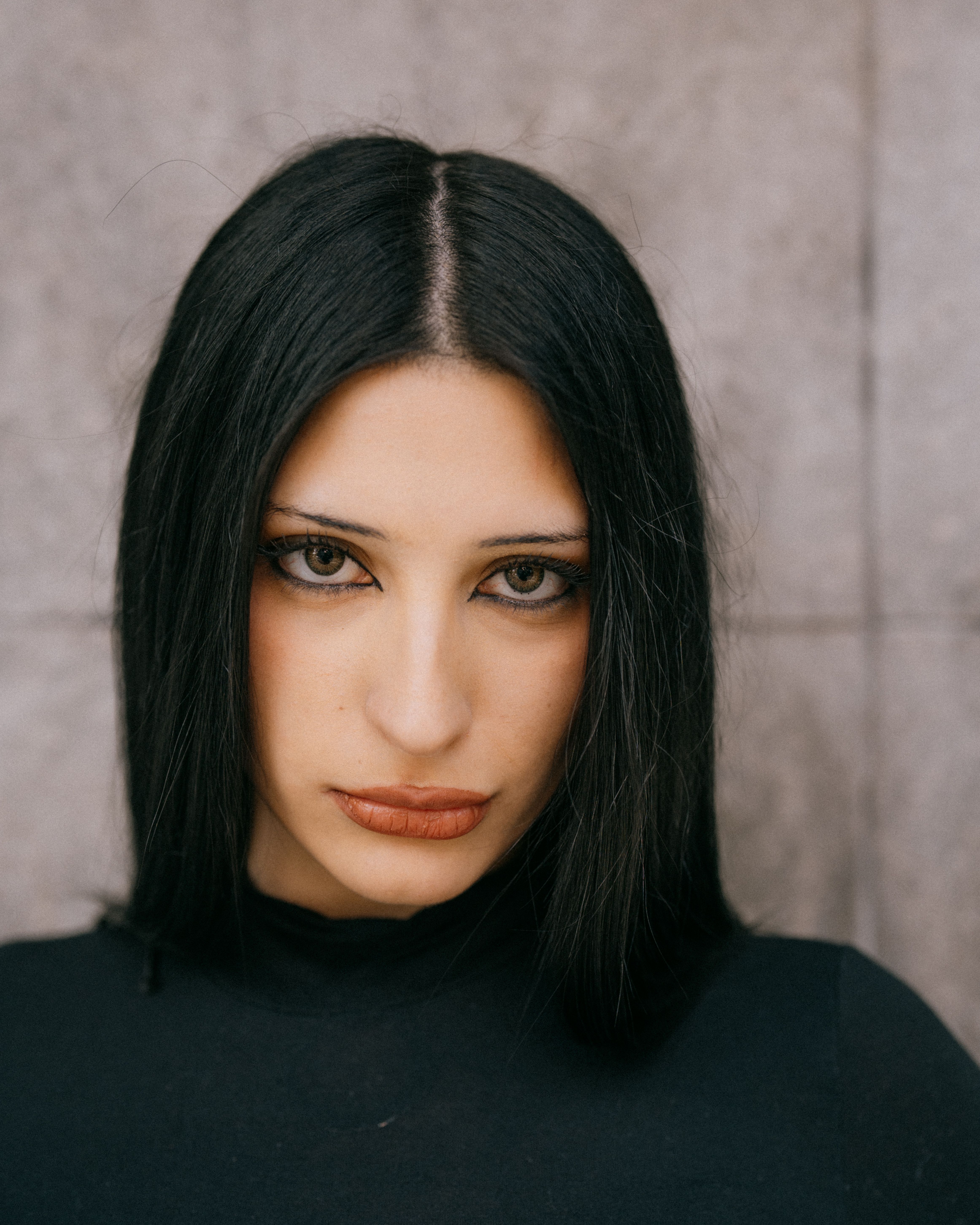 Close-up portrait of a woman with intense expression and dark hair in Buenos Aires.