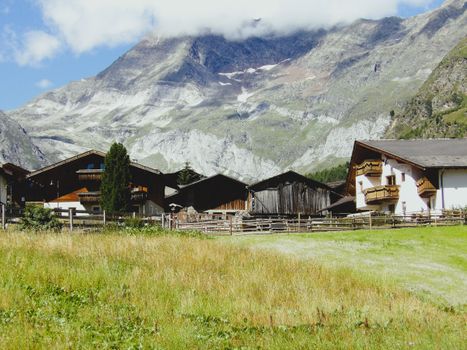 Charming wooden houses surrounded by majestic mountains in Trentino-Alto Adige.