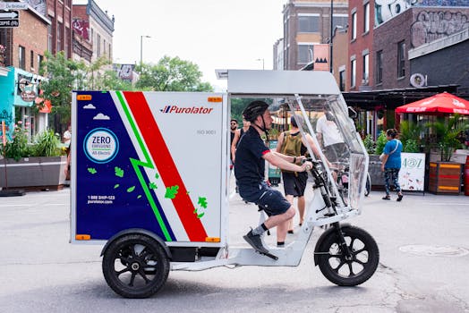 Side view of an electric delivery tricycle operated by a courier in an urban setting, promoting sustainable transit.