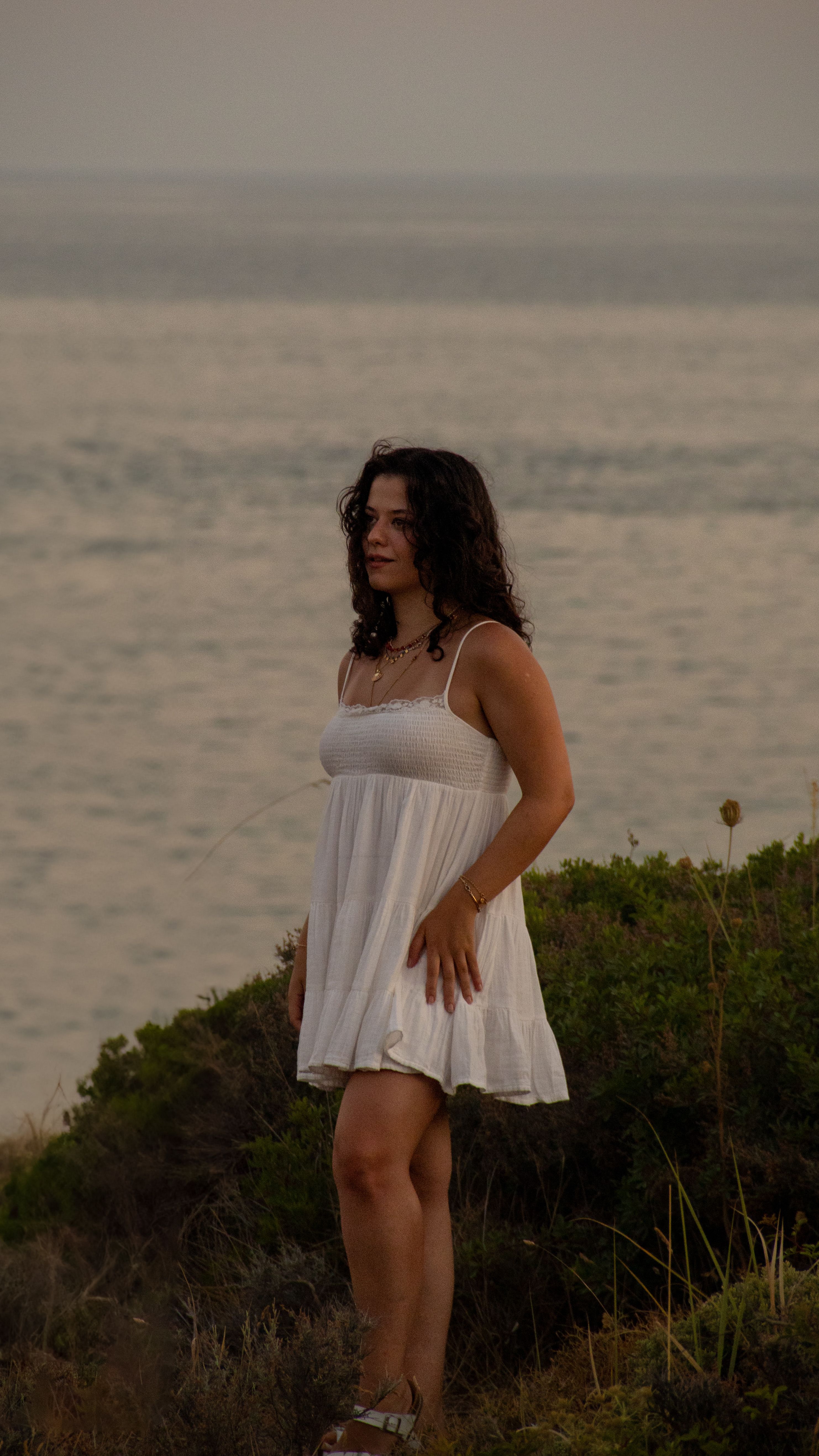 Woman in White Dress by the Sea at Sunset · Free Stock Photo