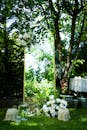 Outdoor Wedding Arch with White Floral Decorations