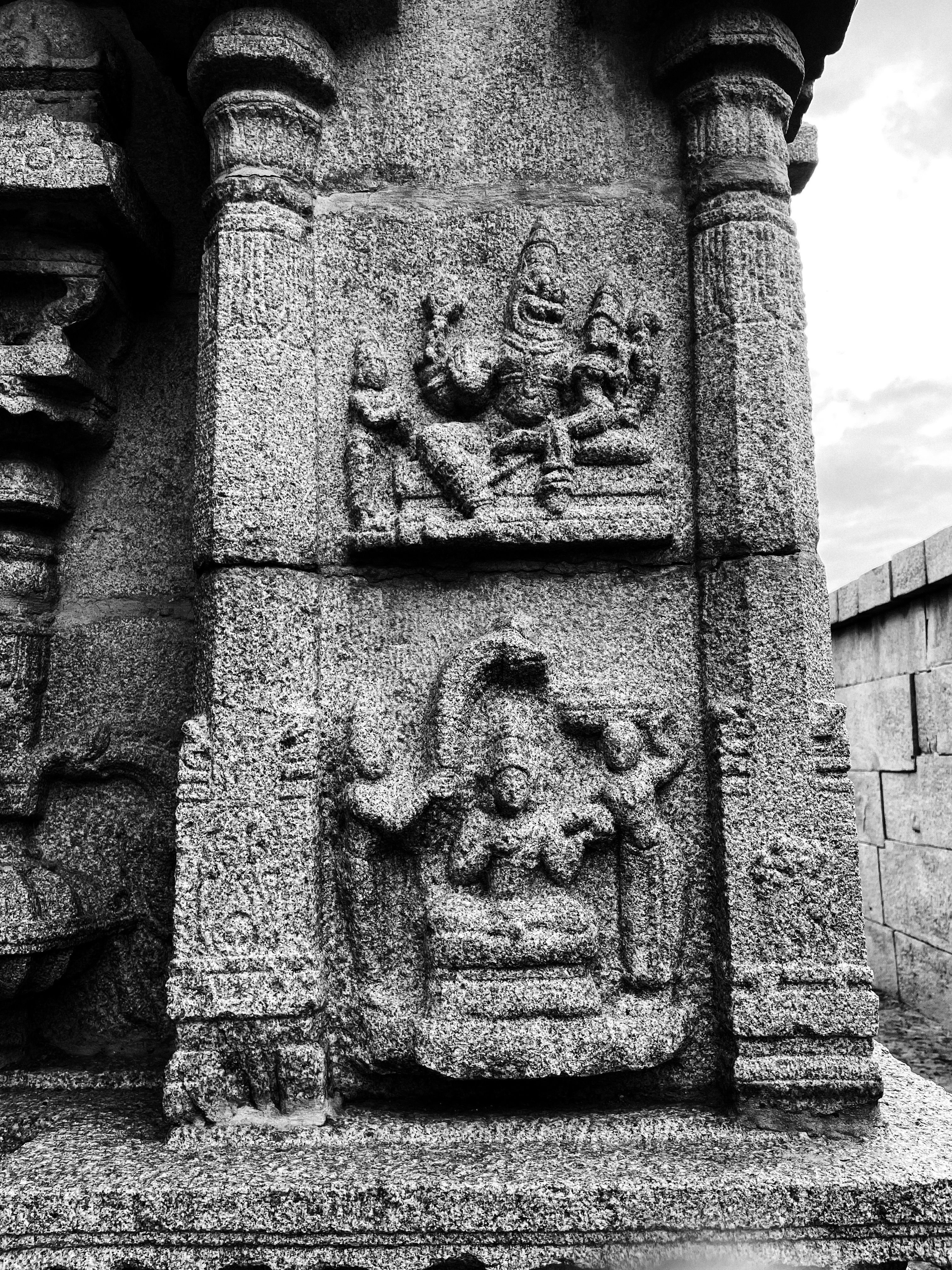 Ancient Stone Carvings on a Temple Wall · Free Stock Photo