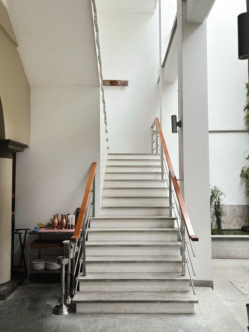 Free Elegant indoor staircase with minimalist design and natural light. Stock Photo