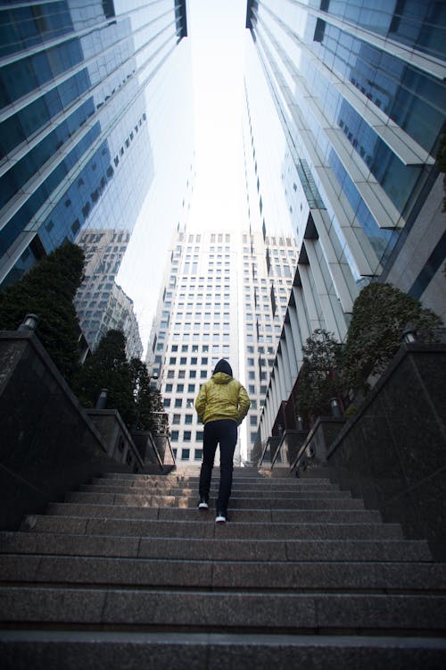 Low-angle Photography of a Person Walking Up a Stairs