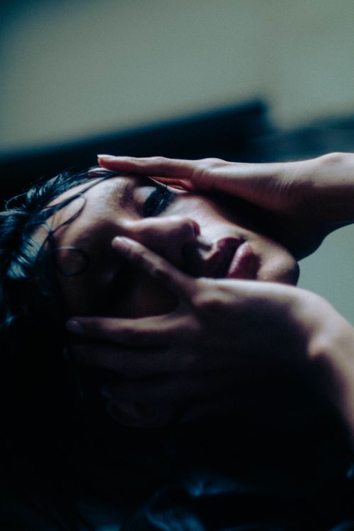 Free A close-up portrait capturing the emotion and expression of a woman reflecting deep thoughts. Stock Photo