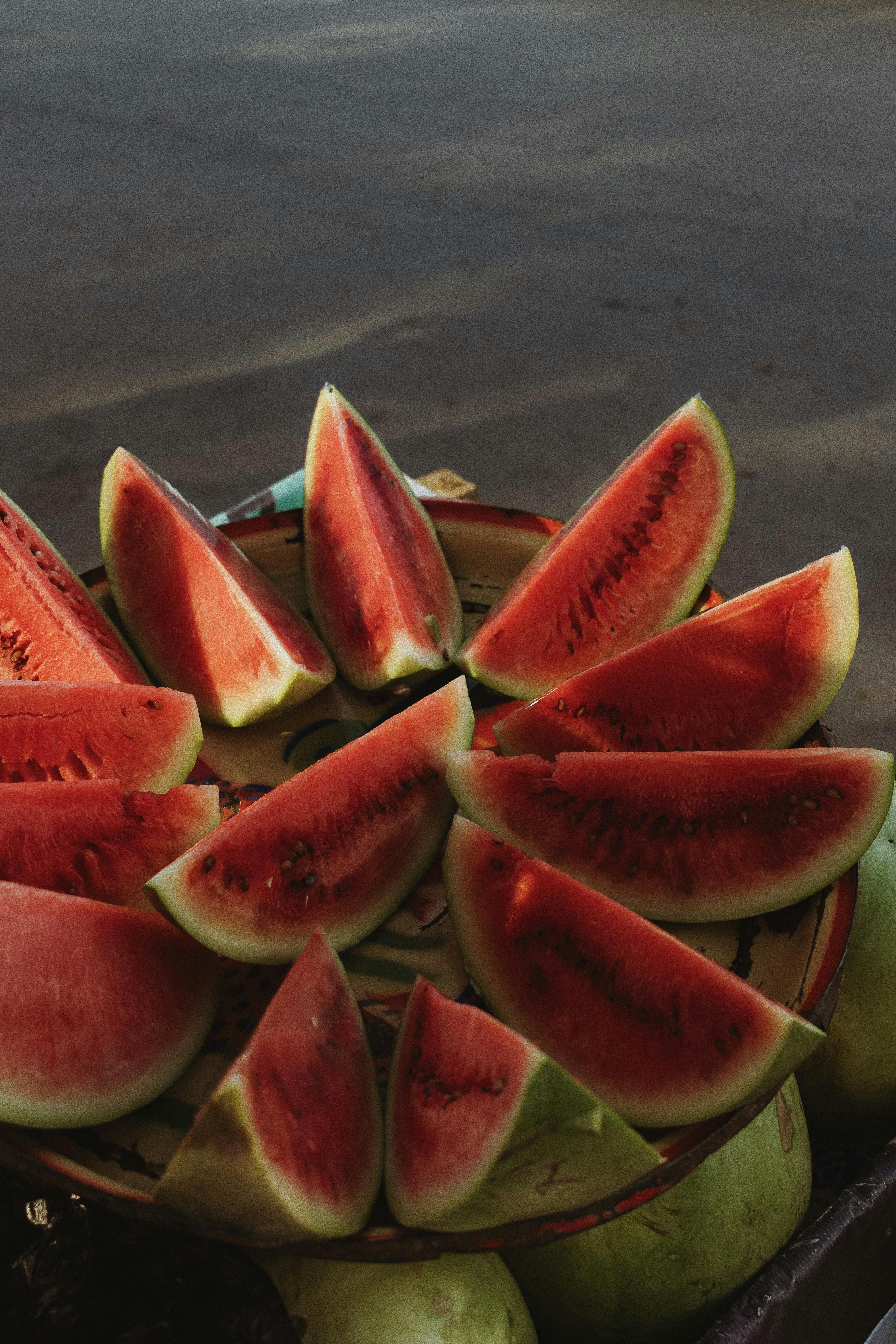 Juicy watermelon slices arranged on a platter under natural light, captured in Nigeria.