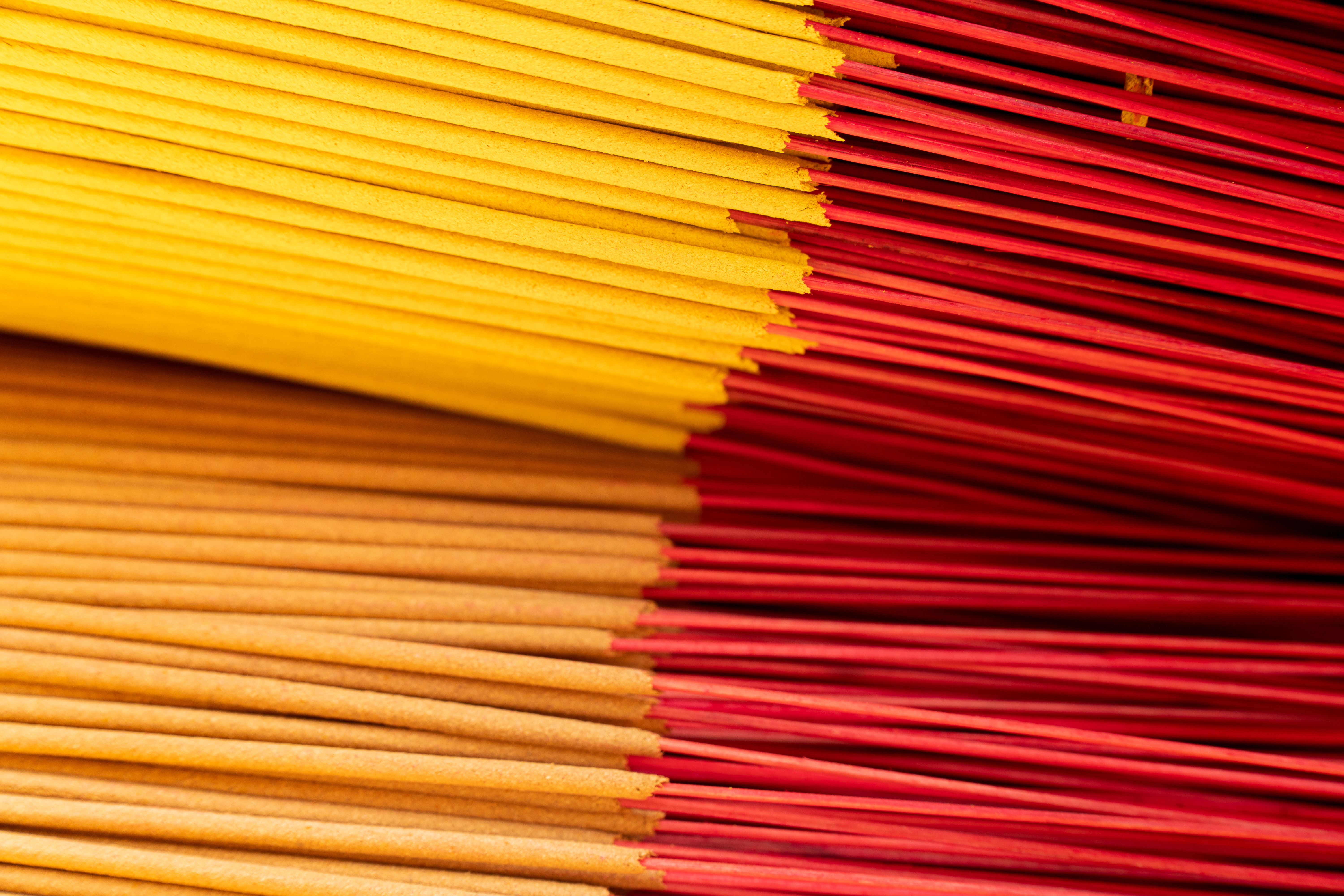 Vibrant Stacks of Vietnamese Incense Sticks · Free Stock Photo