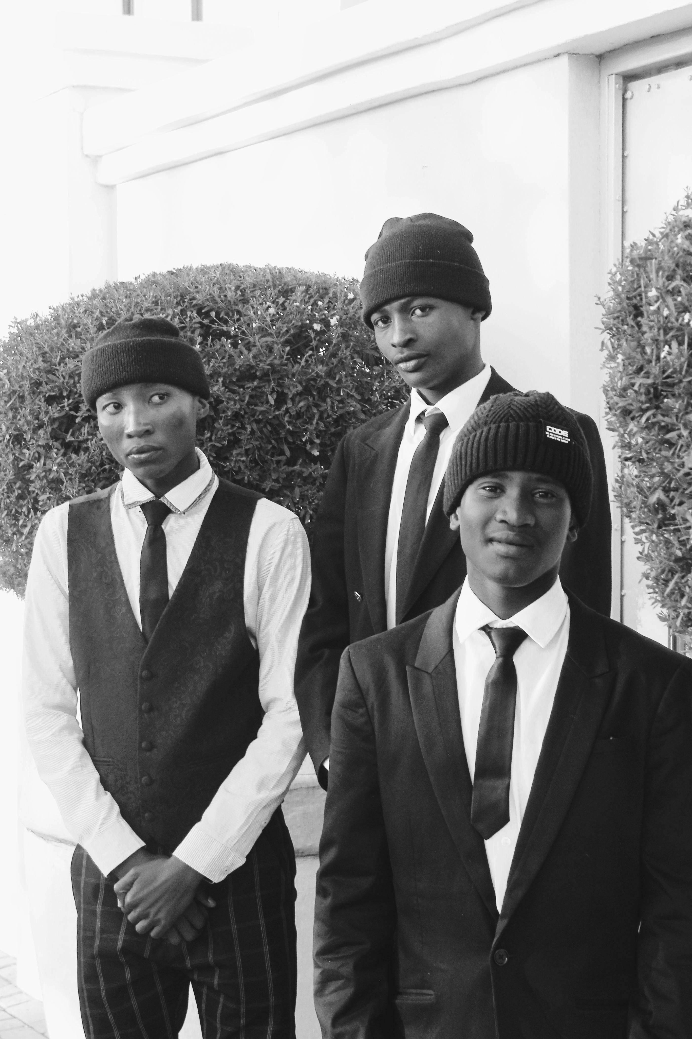 Portrait of Three Men in Formal Attire Outdoors