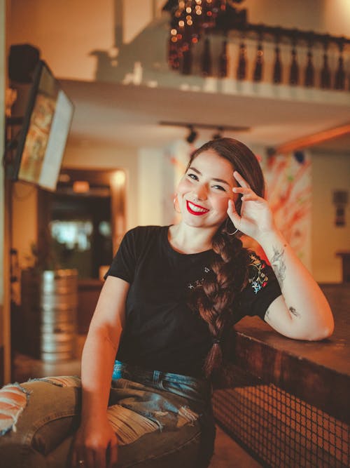 Smiling Woman Leaning at the Table