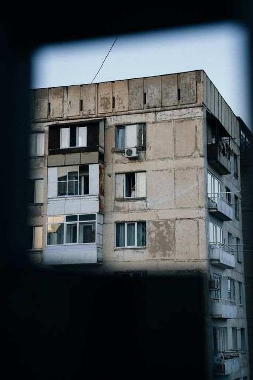Free A weathered apartment building in Tbilisi, showcasing urban decay with peeling paint. Stock Photo