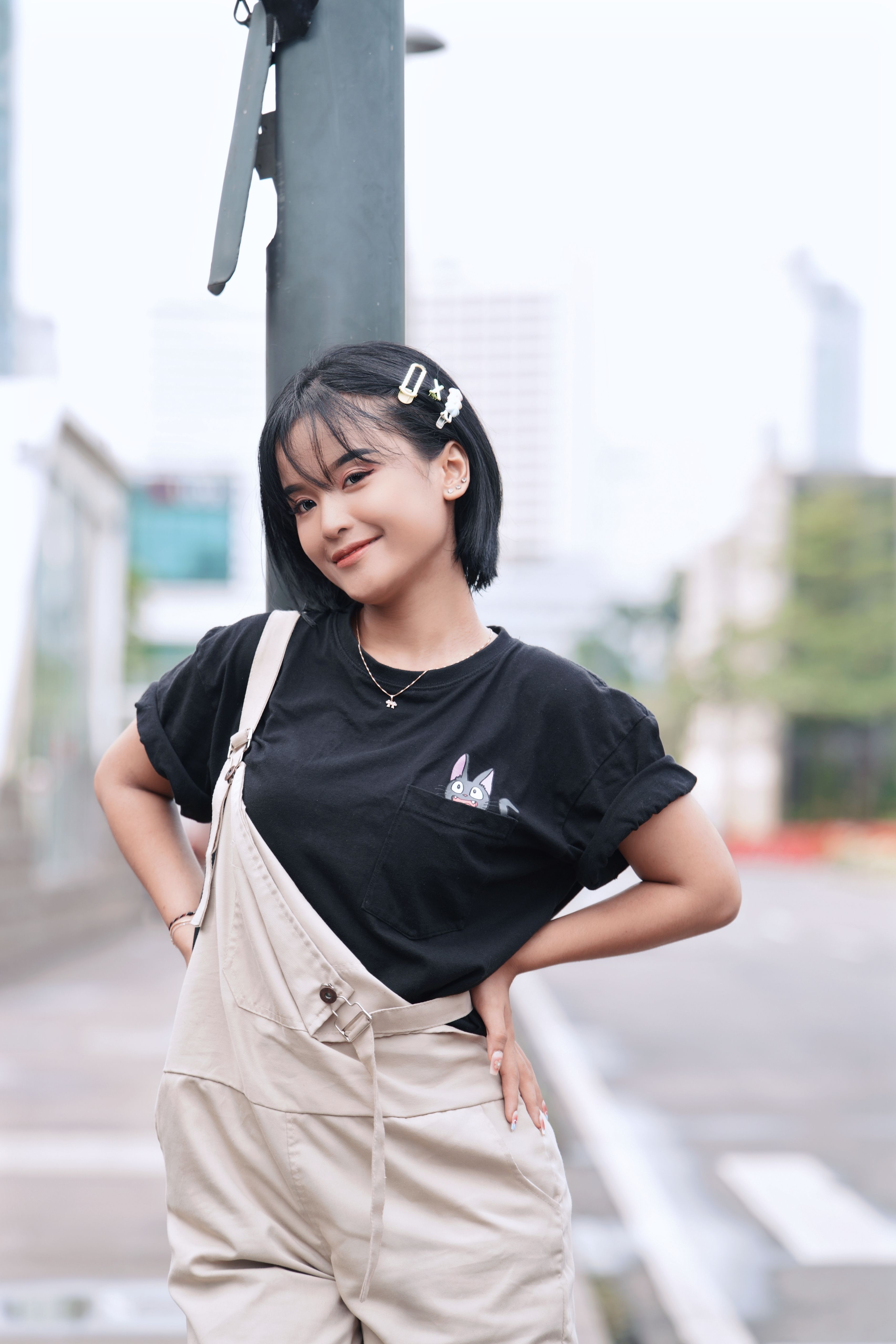 Young Woman Posing Outdoors in Casual Fashion · Free Stock Photo