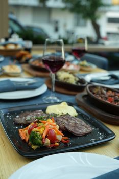 Indulge in a sophisticated dining setting with gourmet dishes and fine wine.