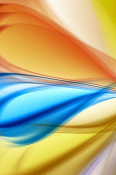 Dynamic abstract art featuring vibrant colorful wave patterns creating a fluid motion effect.