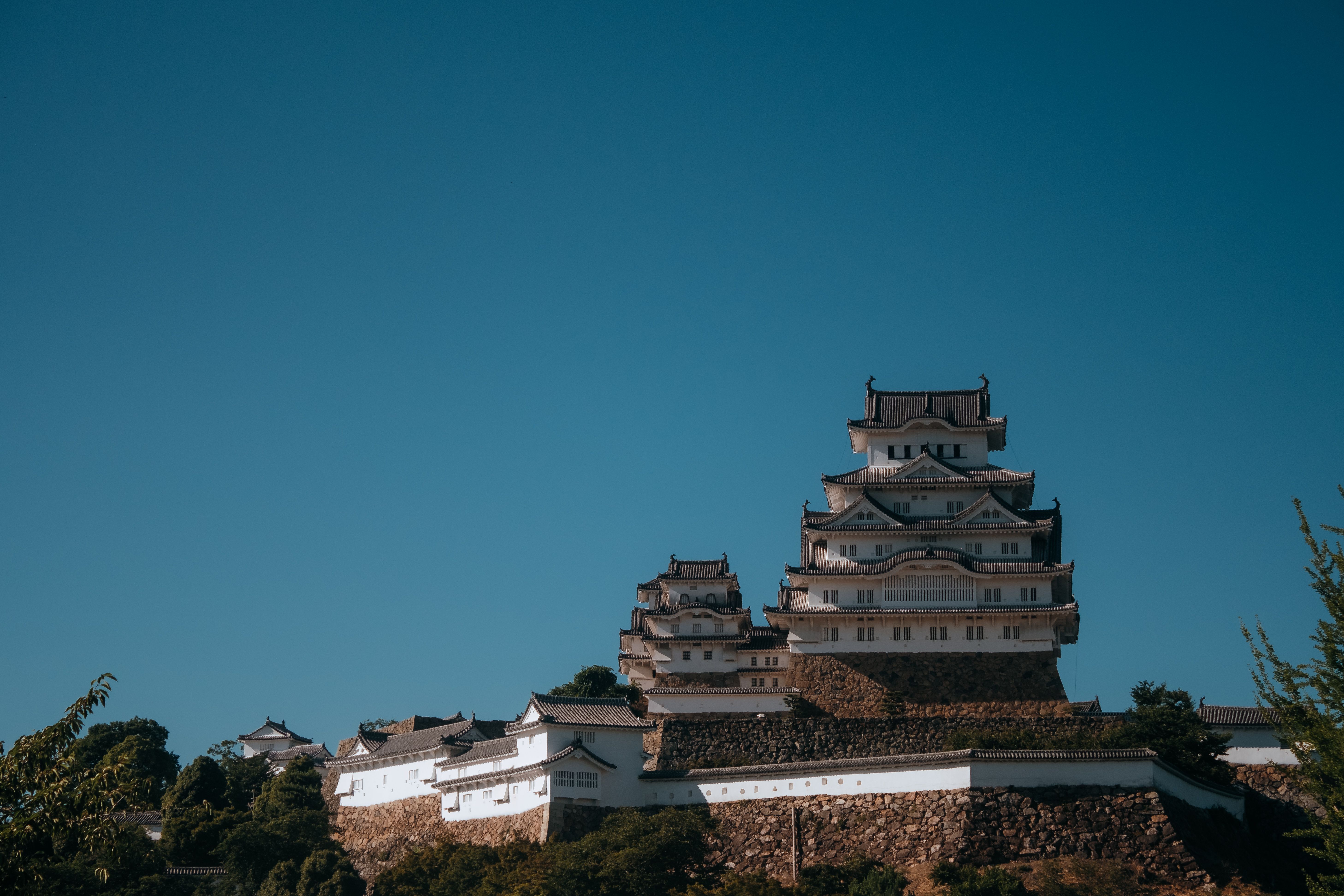A stunning view of Himeji Castle with clear blue sky backdrop.