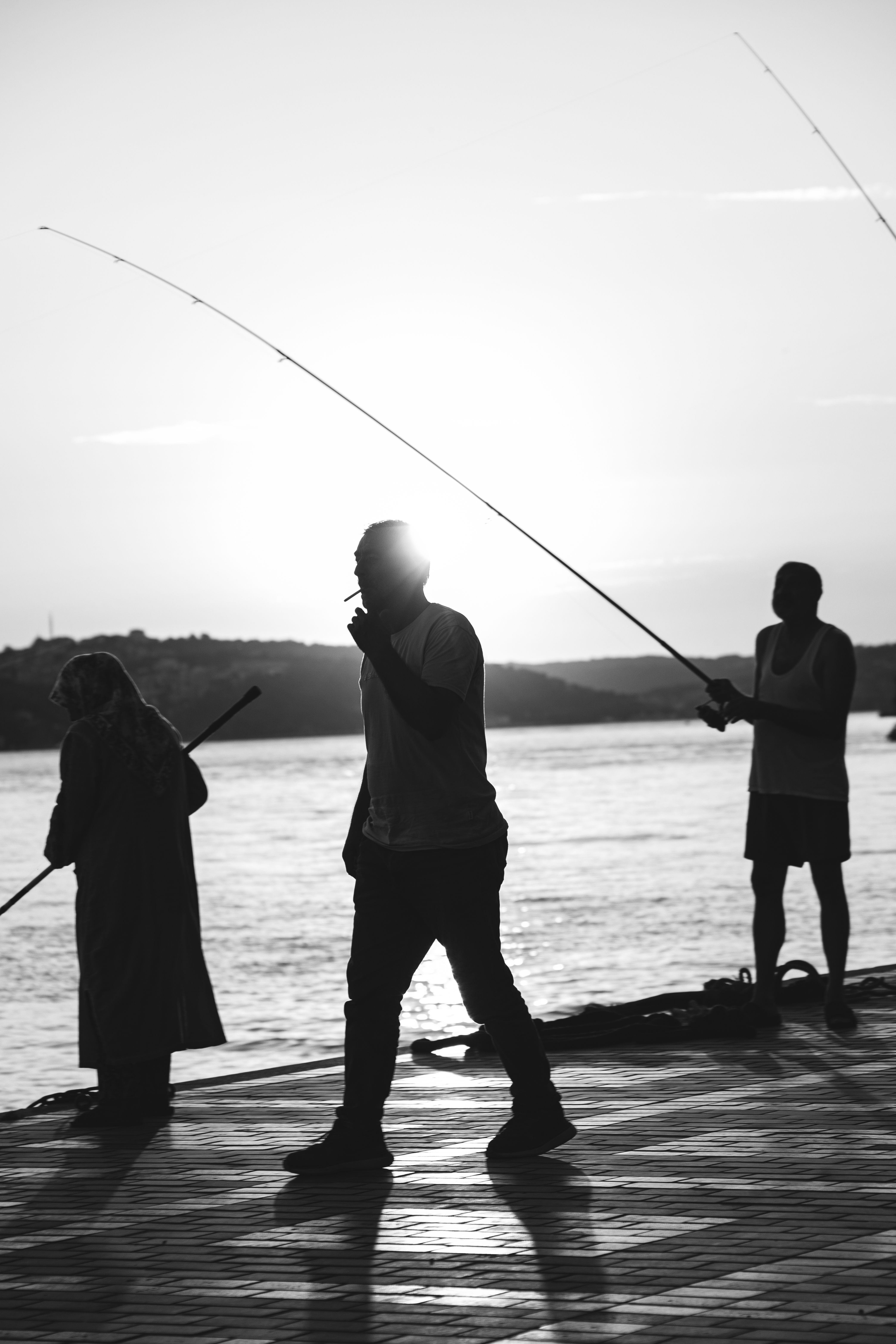 Silhouettes of Fishermen at Sunset on Bosphorus · Free Stock Photo