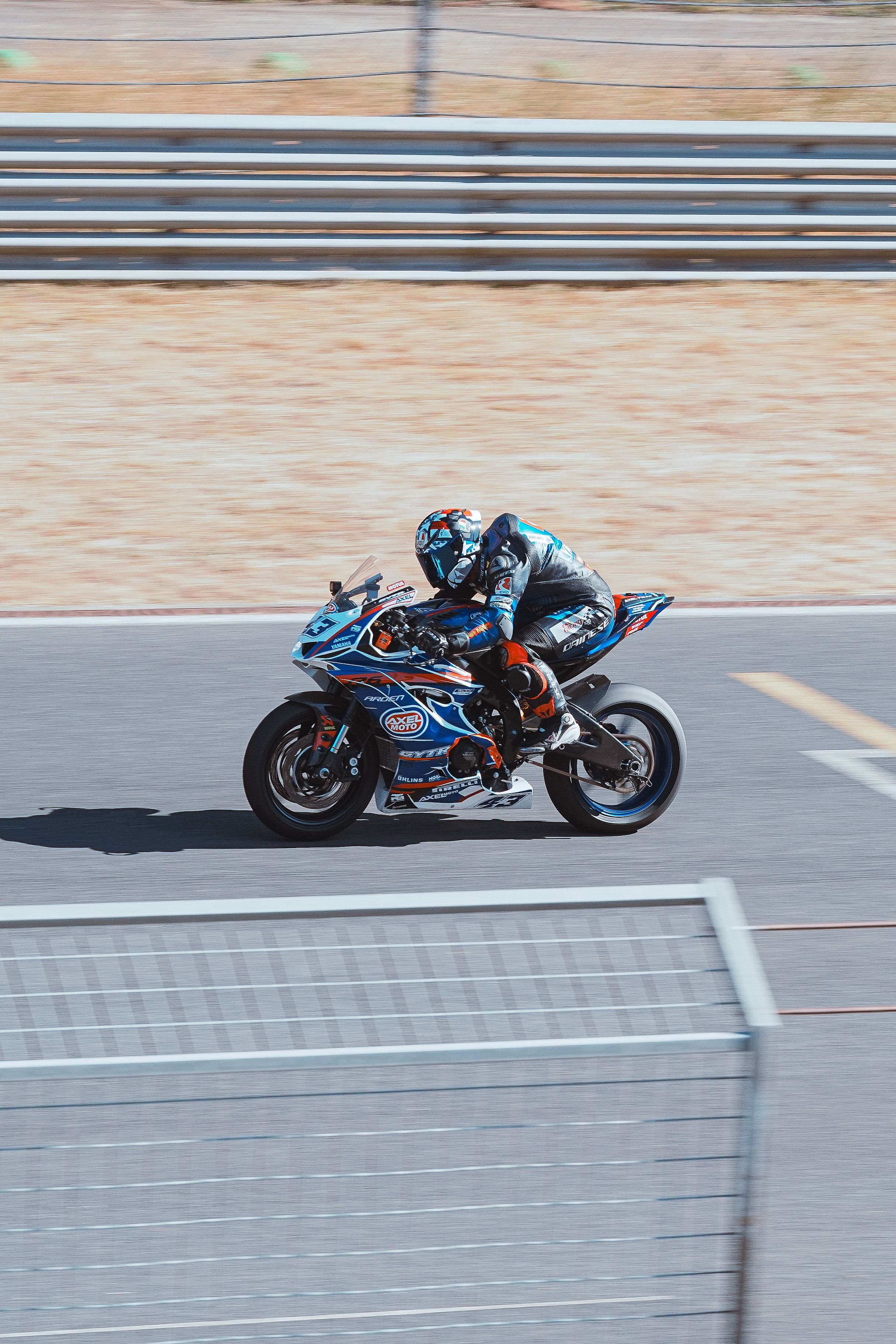 High-Speed Motorcycle Race on Asphalt Track · Free Stock Photo