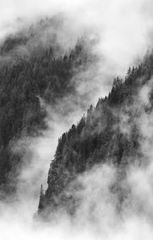 Captivating misty mountain scene in Aosta Valley, Italy, showcasing nature's serene beauty.
