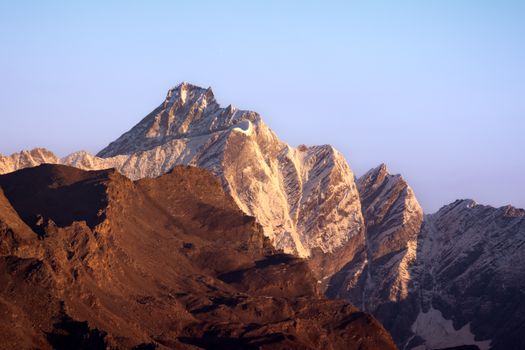 Breathtaking view of the Italian Alps in Aosta Valley, illuminated by the morning sun.