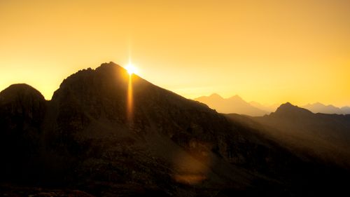 Free Dramatic sunrise over the peaks in Aosta Valley, Italy, casting warm tones. Stock Photo