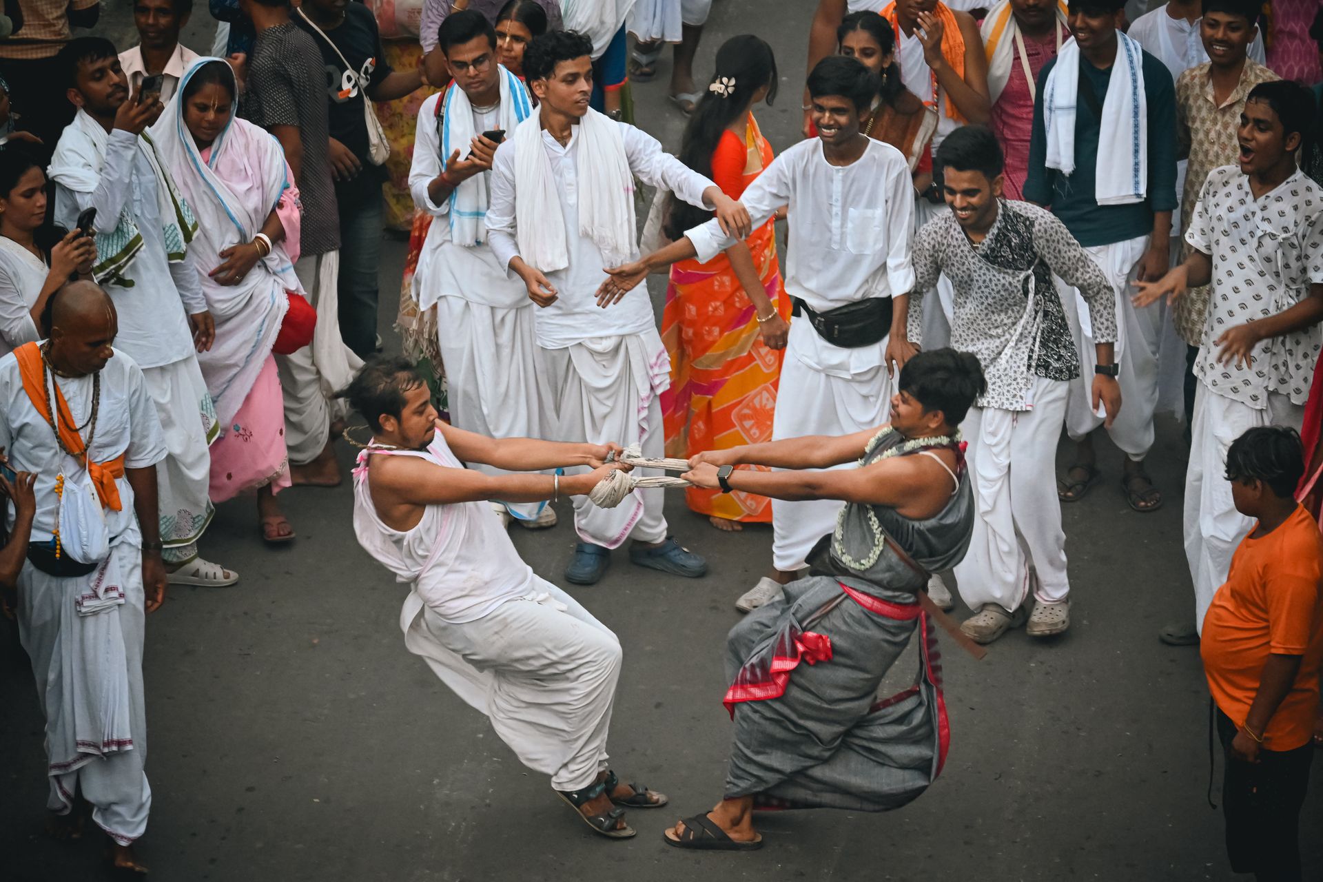 Vibrant street dance scene during a traditional festival in Kolkata, India highlighting cultural heritage.