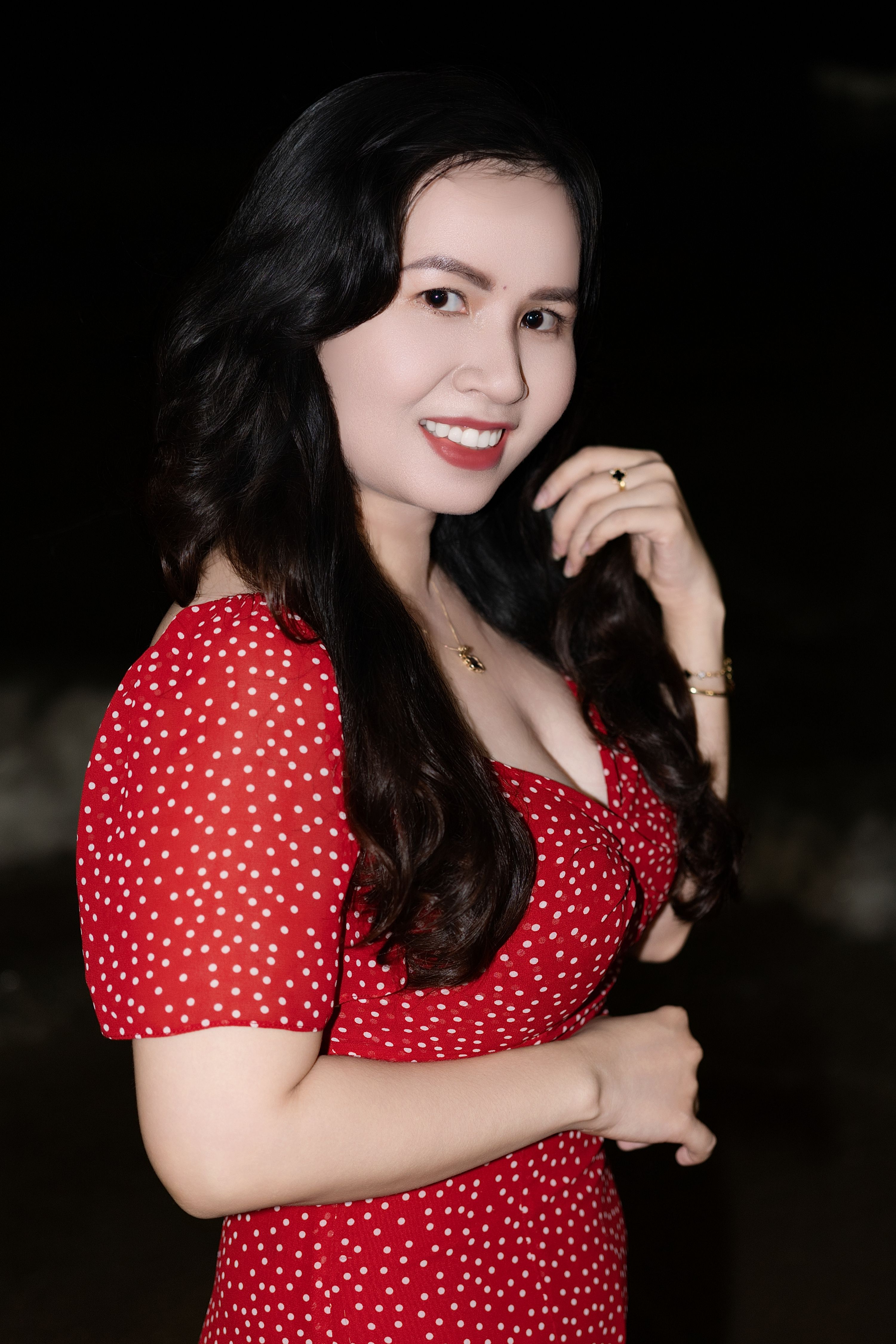 Woman in Red Dress Smiling at Night · Free Stock Photo