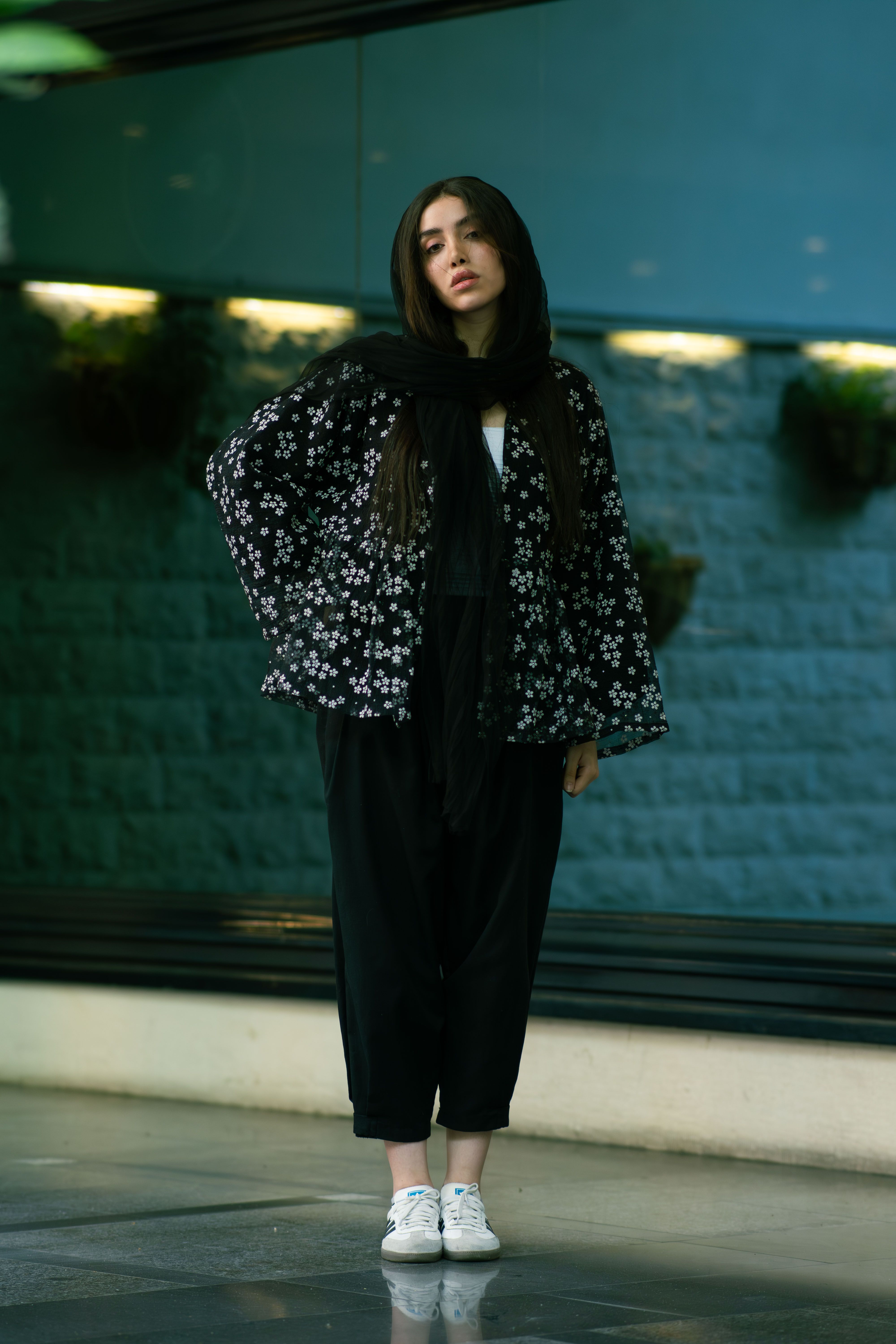 Stylish portrait of a woman in floral attire, indoors in Tehran.