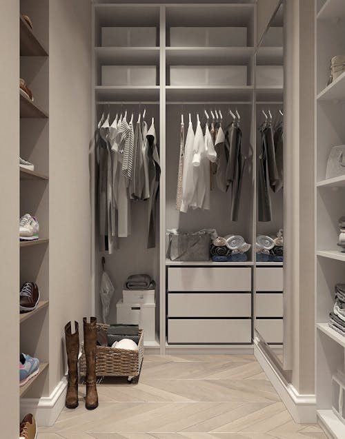 Assorted Clothes Hanged Inside Cabinet