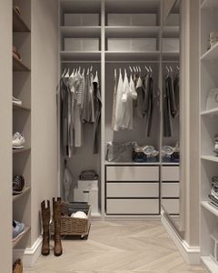Stylish walk-in closet with neutral tones and contemporary design elements.