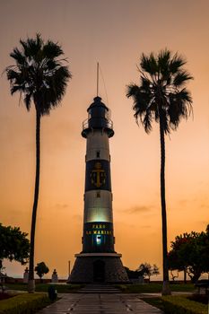 Scenic view of Faro La Marina lighthouse at sunset in Miraflores, Lima, Peru.