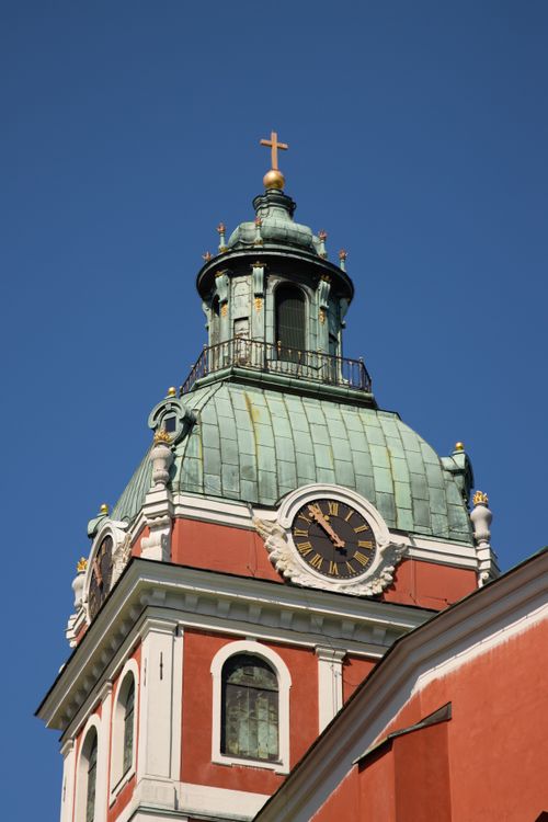 Free Close-up of St. Jacob's Church bell tower in Stockholm against a clear blue sky. Stock Photo