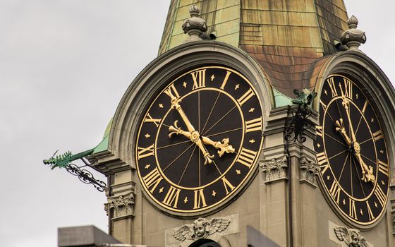 Close-up of a historic clock tower with Roman numerals in Bern, Switzerland.