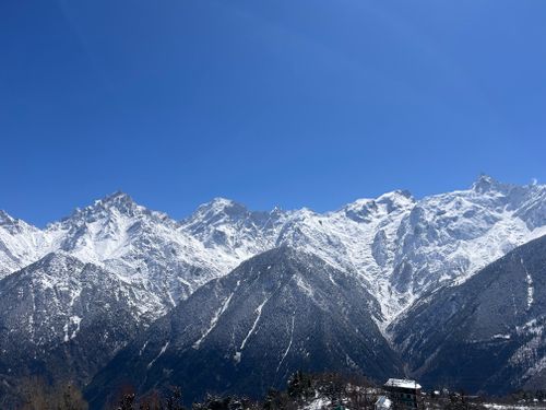 Free Majestic snowy mountains under a clear blue sky in Kalpa, Himachal Pradesh, India. Stock Photo