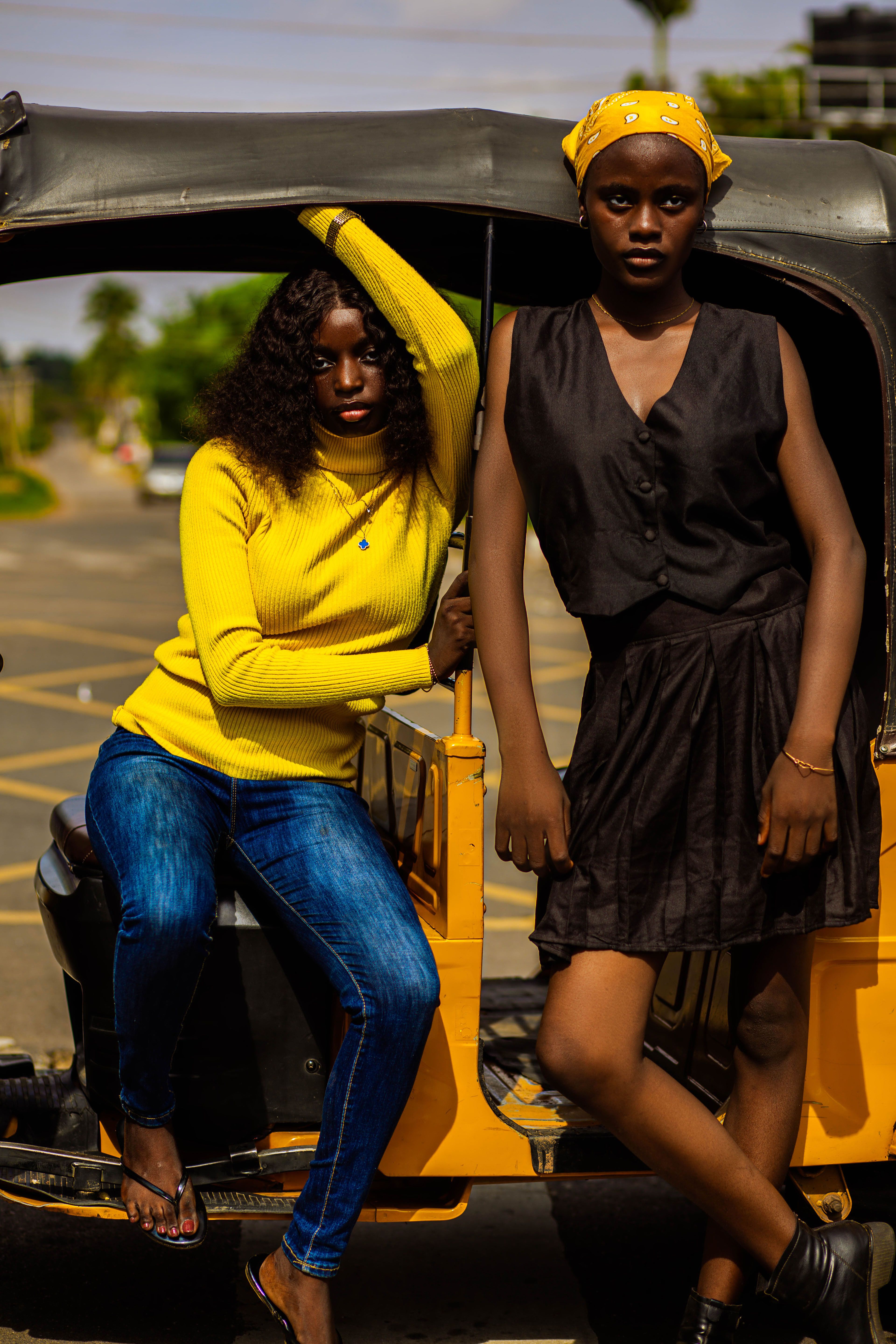 Stylish Women Posing with Auto Rickshaw Outdoors · Free Stock Photo